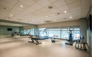 a gym with several treadmills and machines in a room at Holiday Inn Express New Delhi International Airport T3, an IHG Hotel in New Delhi