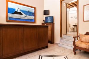 a lobby of a hotel with a waiting room at Egli Hotel in Andros