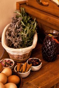 a table with eggs and a plant in a basket at Egli Hotel in Andros