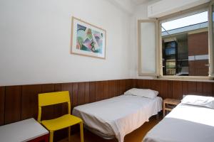 Ένα ή περισσότερα κρεβάτια σε δωμάτιο στο M027 - Marcelli, trilocale con terrazzo a 150 metri dal mare