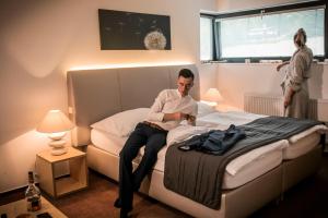 Postel nebo postele na pokoji v ubytování Hotel & Garden U Holubů