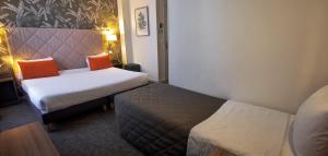 Cama ou camas em um quarto em Hotel Continental