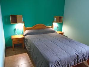 A bed or beds in a room at Apartamentos Rurales El Gobernador