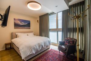 Un pat sau paturi într-o cameră la Dream Penthouse