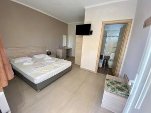Postel nebo postele na pokoji v ubytování Hotel Stella