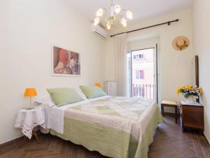 a bedroom with a large bed and a window at Apartment Regina's House - St Peter by Interhome in Rome