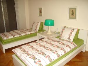 A bed or beds in a room at Bulhotel Pritzker Apartment