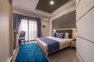 Кровать или кровати в номере Royal Day Plaza Hotel