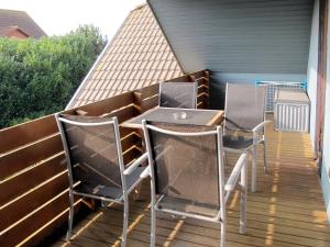 a patio with chairs and a table on a deck at Apartment Zeit zum Träumen II by Interhome in Breege