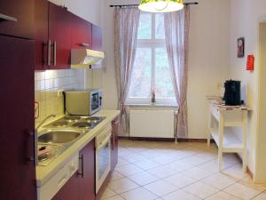 a small kitchen with a sink and a window at Apartment Wildrose by Interhome in Zempin