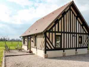 a barn conversion with a black and white roof at Holiday Home La Prairie - CRB400 by Interhome in Corbon