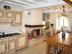 A kitchen or kitchenette at Holiday Home Dans la Prairie - CEZ404