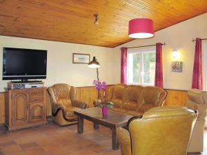A seating area at Holiday Home Entre mer et campagne 3 - LMX401