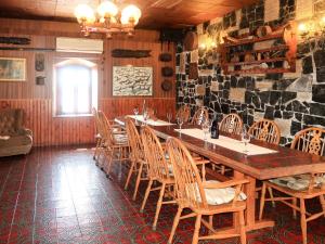 a dining room with a large wooden table and chairs at Holiday Home Delfar by Interhome in Nerezine