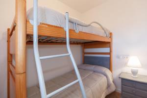 Katil atau katil-katil dalam bilik di Apartamento Vora Mar 33