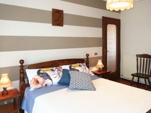 una camera con un letto a righe di Apartment Il Nido by Interhome a Vallecrosia