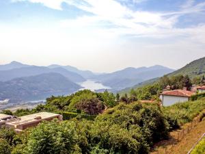 a view of a valley with mountains and a lake at Apartment Bellavista Erika 19 by Interhome in Cademario +19 photos