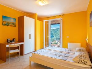 A bed or beds in a room at Apartment Arancia - PTB153 by Interhome