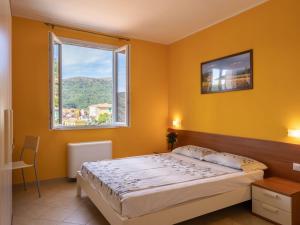 A bed or beds in a room at Apartment Arancia - PTB153 by Interhome
