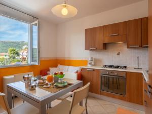 A kitchen or kitchenette at Apartment Arancia - PTB153 by Interhome