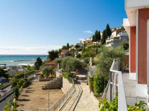 een balkon met uitzicht op de oceaan bij Holiday Home Gelsomino - SLR403 by Interhome in San Lorenzo al Mare