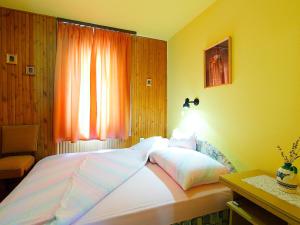 Posteľ alebo postele v izbe v ubytovaní Holiday Home Kiwi by Interhome