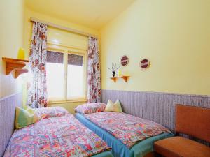 Posteľ alebo postele v izbe v ubytovaní Holiday Home Kiwi by Interhome