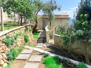 A garden outside Holiday Home Giorgia - BGB100 by Interhome