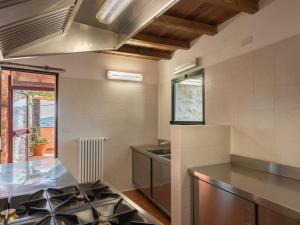 A kitchen or kitchenette at Holiday Home U Figu du Camin by Interhome