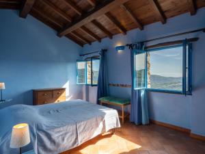 A bed or beds in a room at Holiday Home U Figu du Camin by Interhome