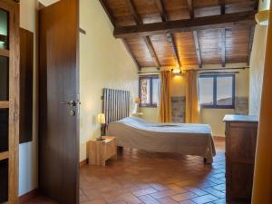 A bed or beds in a room at Holiday Home U Figu du Camin by Interhome