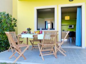a table and chairs sitting on a patio at Apartment Belvedere Village-2 by Interhome in Cavalcaselle
