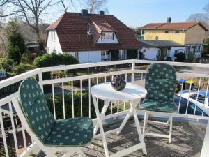 two chairs and a table on a balcony at Apartment Lemke by Interhome in Prerow