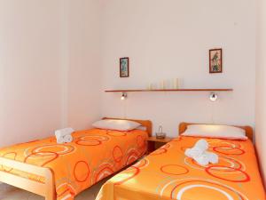 two beds sitting next to each other in a room at Apartment Radmila - MLK140 by Interhome in Gostinjac