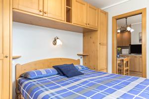 Postel nebo postele na pokoji v ubytování Omega - Casa Azzurra piano terra