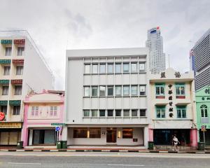 a white building in the middle of a city at KINN Capsule - HER Space, Female Only in Singapore +9 photos