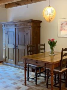 a dining room with a wooden table and chairs at Old Town Loft & Central Location in Rapperswil in Rapperswil-Jona