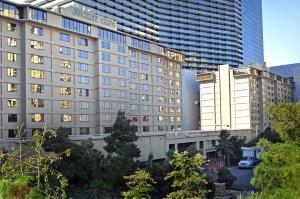 a view of a building with two tall buildings at Jockey Club Suites in Las Vegas