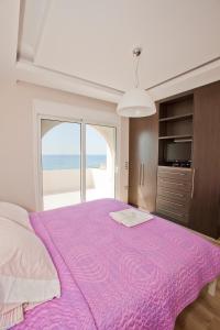 Ένα ή περισσότερα κρεβάτια σε δωμάτιο στο Kiotari Beach Villas - Luxury Retreat