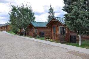a cabin on the side of a gravel road at Bryce Country Cabins in Tropic