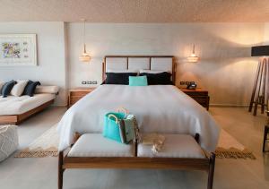 Postel nebo postele na pokoji v ubytování Mvngata Beach Hotel