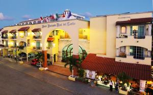 a group of buildings on a city street at Hacienda Real del Caribe Hotel in Playa del Carmen