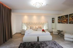 A bed or beds in a room at J'Me Boutique Hotel - Adults only