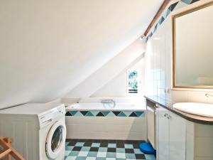 a bathroom with a sink and a washing machine at Apartment Villa Marie by Interhome in Purkersdorf