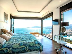 a bedroom with a bed and a desk at Villa Bali Infinity Plus by Interhome in Jávea