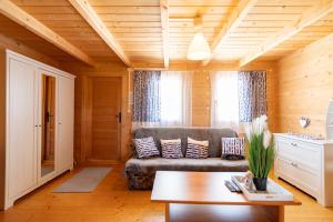 a living room with a couch and a table at Marina in Jarosławiec