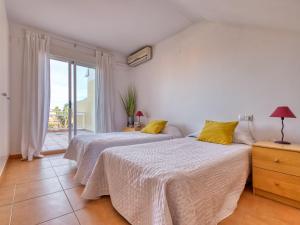 Posteľ alebo postele v izbe v ubytovaní Holiday Home Jardines de Denia I by Interhome