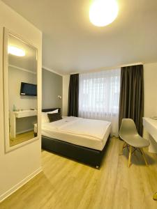 Postel nebo postele na pokoji v ubytování Rußmann Hotel & Living