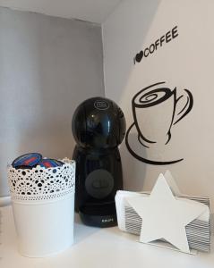 a coffee maker and a star on a counter at CasaMarè in Taranto +22 photos