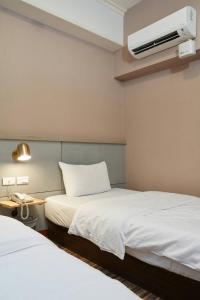 Letto o letti in una camera di At Tainan Inn